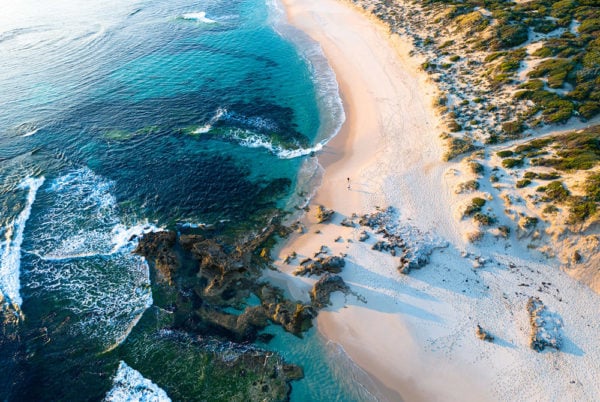 Aerial view of Mornington Peninsula, a white sand bay with underwater reef